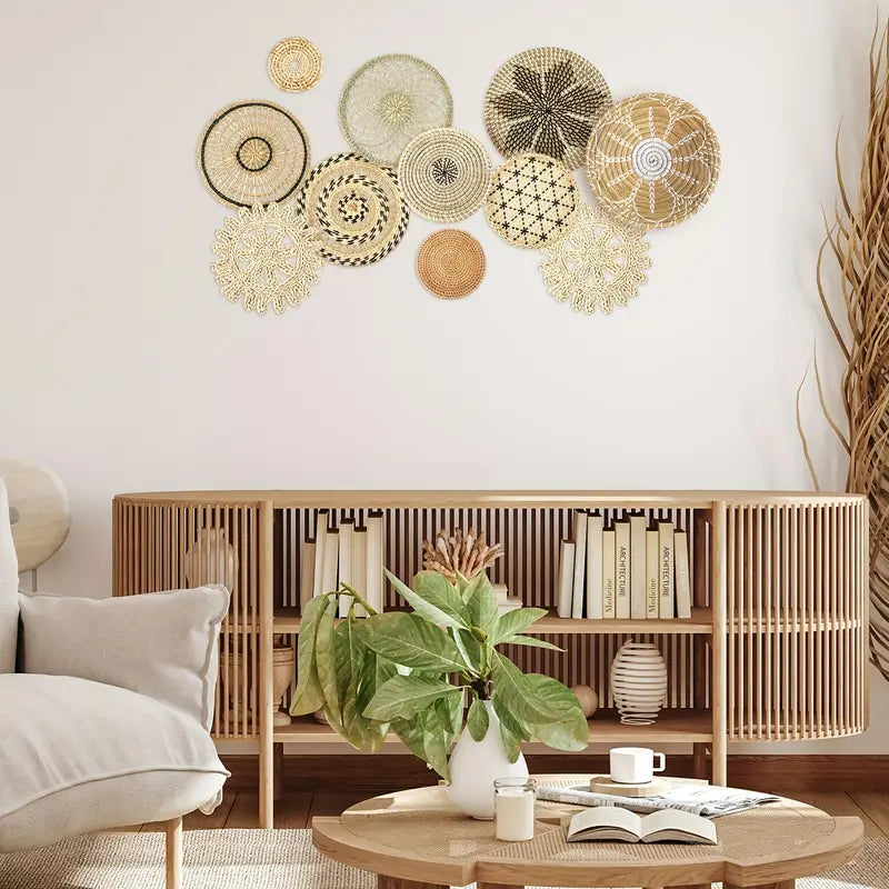 Living room with decorative wall art, bookshelf, and coffee table.