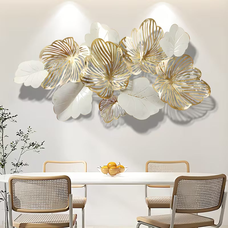 Decorative wall art with gold and white floral designs in a dining room setting.
