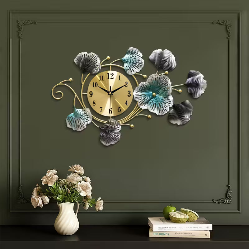 Decorative wall clock with floral designs on a dark green wall.