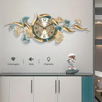 Decorative wall clock with floral designs on a wall above a cabinet.