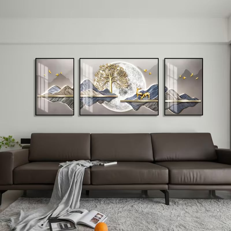 Living room with a brown sofa and three framed artworks on the wall.