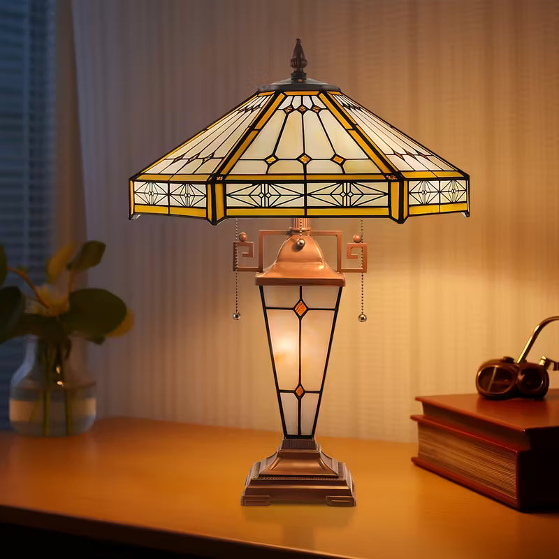 Stained glass table lamp on a wooden surface with a blurred background