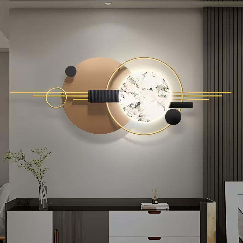 Modern wall light fixture on a neutral wall with decorative elements.