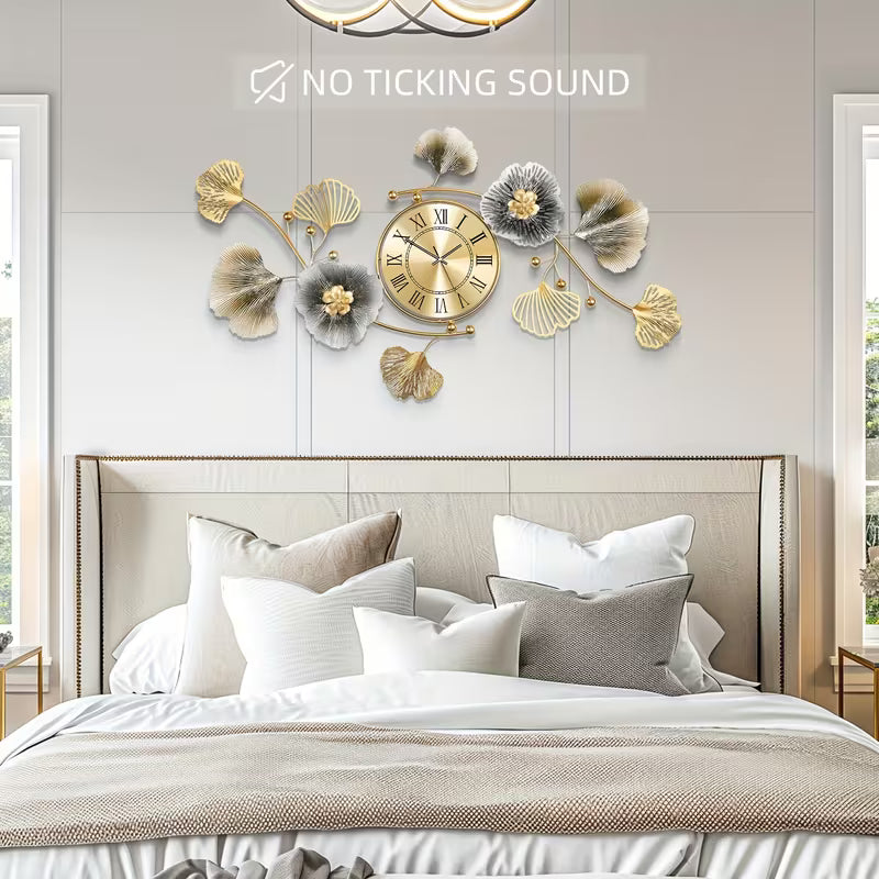 Decorative wall clock with floral elements above a bed in a bedroom setting.
