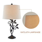 Decorative table lamp with an oatcloth lampshade on a white background