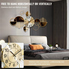 Modern wall clock with gold and black design in a bedroom setting