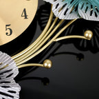 Decorative clock with gold and silver design elements on a black background