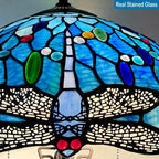 Stained glass lamp with blue, green, and red colors on a gray background