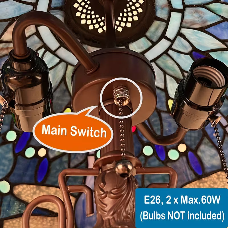 Decorative light fixture with stained glass background and labeled main switch.