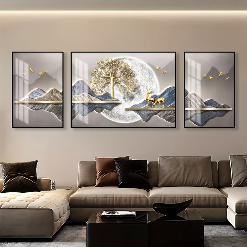 Modern living room with a beige sofa and wall art depicting mountains and a deer.