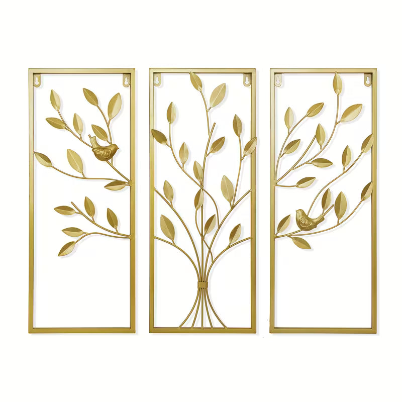 Three gold leaf-patterned wall art panels on a white background