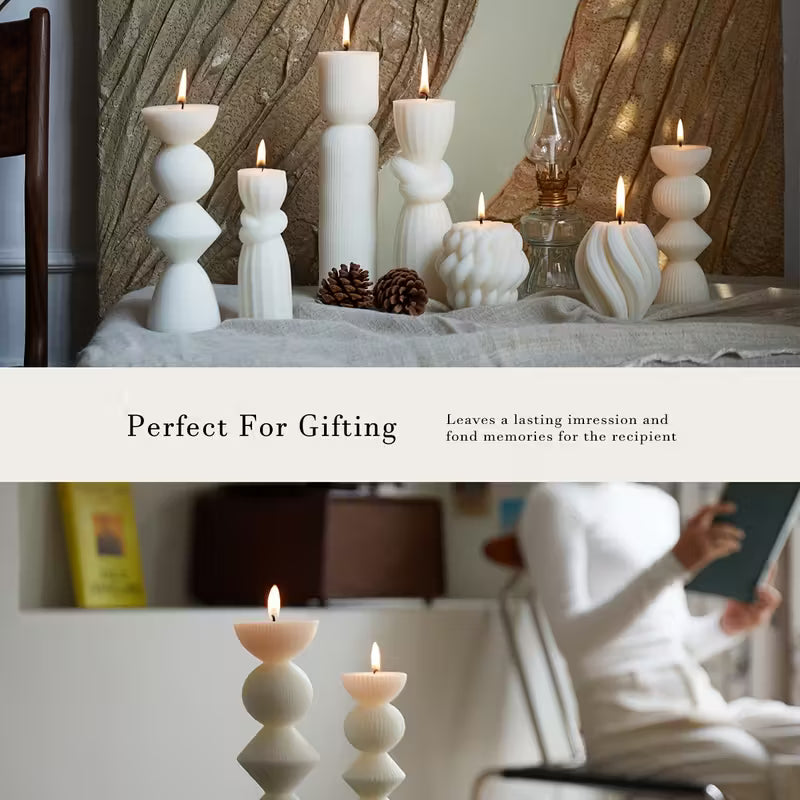 Decorative candles on a table with a person reading a book in a cozy room.